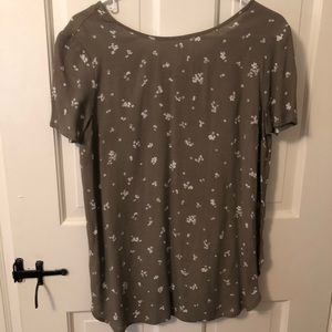 Green blouse with white flower detail